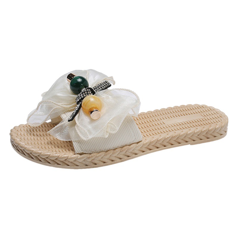 涼しい女性2021夏の新型アンドロメダ風蝶ネクタイの外にリゾートビーチの平底のスリッパを着ている女性