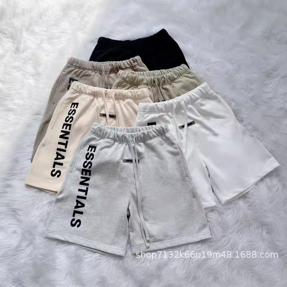 Double-line ESSENTIALS high-street loose-fitting letter shorts, unisex five-point couple pants, drop shipping available.