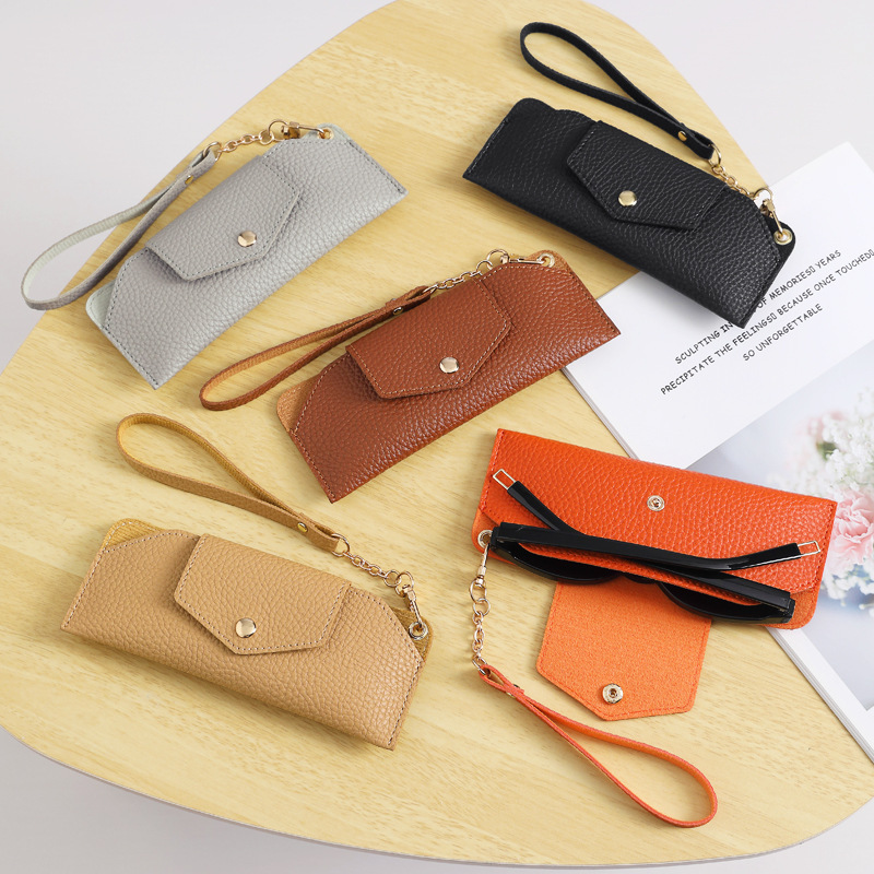 Caja de gafas de cuero de PVC al por mayor, botón de torsión suave pu, gafas de miopía, bolsa de gafas de sol, venta directa de fábrica