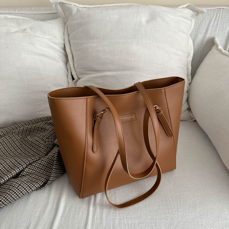 Bolsa de mano de viaje de color sólido bolsa de mano nueva alta alta capacidad axilar otoño y invierno 2024 bolsa de trabajo bolsa de mujer