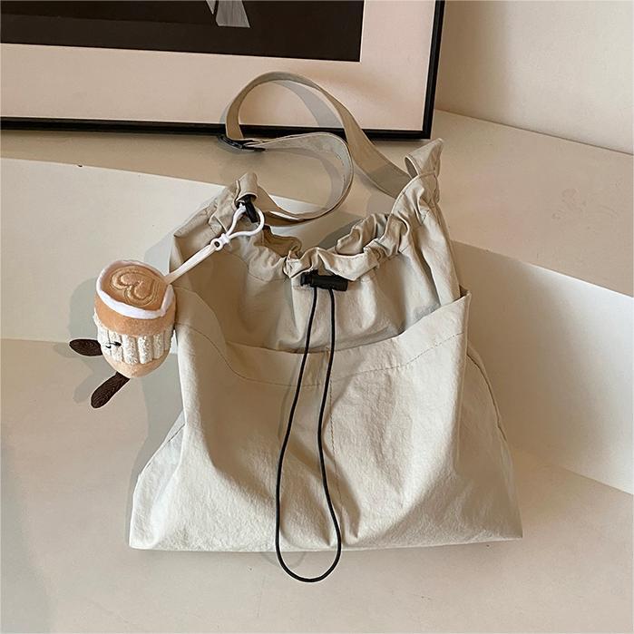 Bolsa de lona de moda simple 2024 nueva bolsa de mujer bolsa de hombro casual versátil de gran capacidad de viaje al trabajo bolso de cubo