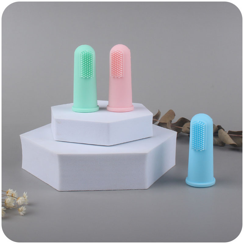 Nuevo bebé suministros de silicona dedo conjunto cepillo de dientes bebé pelo suave dedo cepillo de dientes creativo silicona teether Amazon