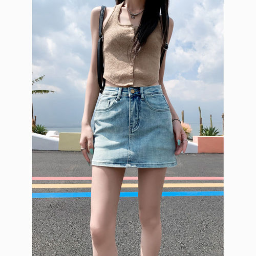 Leather-lined stretch denim short skirt for 2025, high-waisted, flattering for petite figures, showcasing a curvy silhouette.