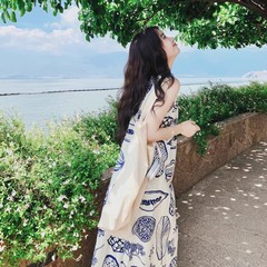 海辺の休暇のノースリーブワンピース夏の旅行はフランスのレトロな文芸を着ています。