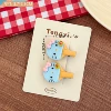 Blue racket for table tennis, hairgrip, kitten