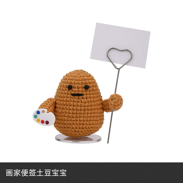 The painter signs a potato baby