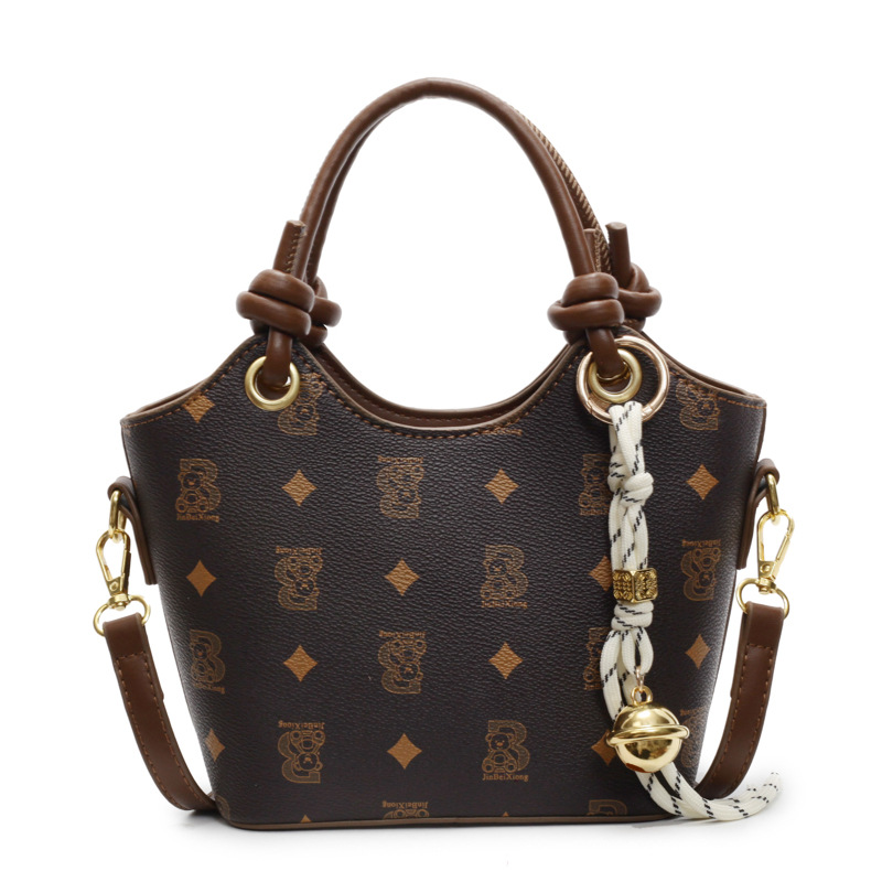 Tendencia impresa bolso de cubo de mano mujer 2025 nueva moda textura versátil bolso de hombro super caliente bolso de mochila