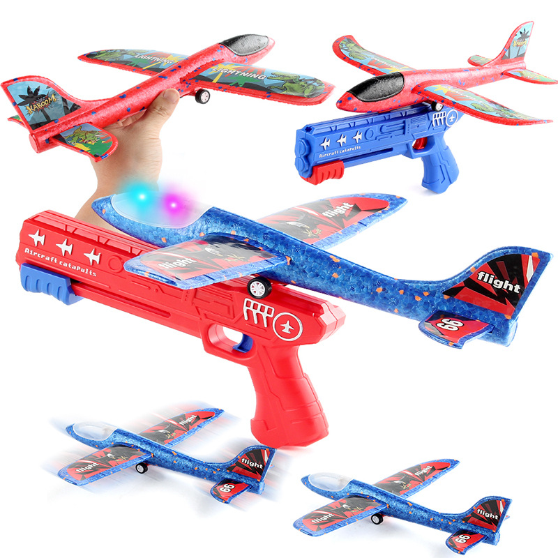 Lanzamiento de un clic espuma emisora de luz Catapulta Aeronave pistola lanzadora de mano planeador juguetes al aire libre para niños puesto de mercado nocturno Juguetes image 3