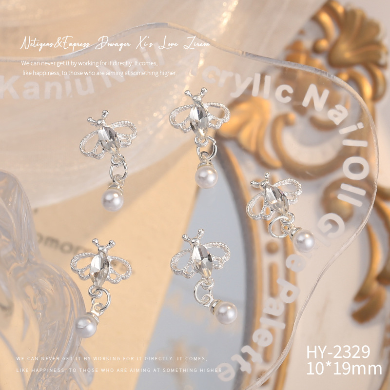 Nueva joyería de aleación de manicura completa diamante borla arco corona plata uñas manicura joyería accesorios al por mayor