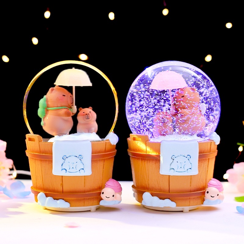Caja de música de bola de cristal de Kapibala ingenua y linda, adornos de escritorio luminosos, nieve que cae, regalo de cumpleaños para estudiantes y niños