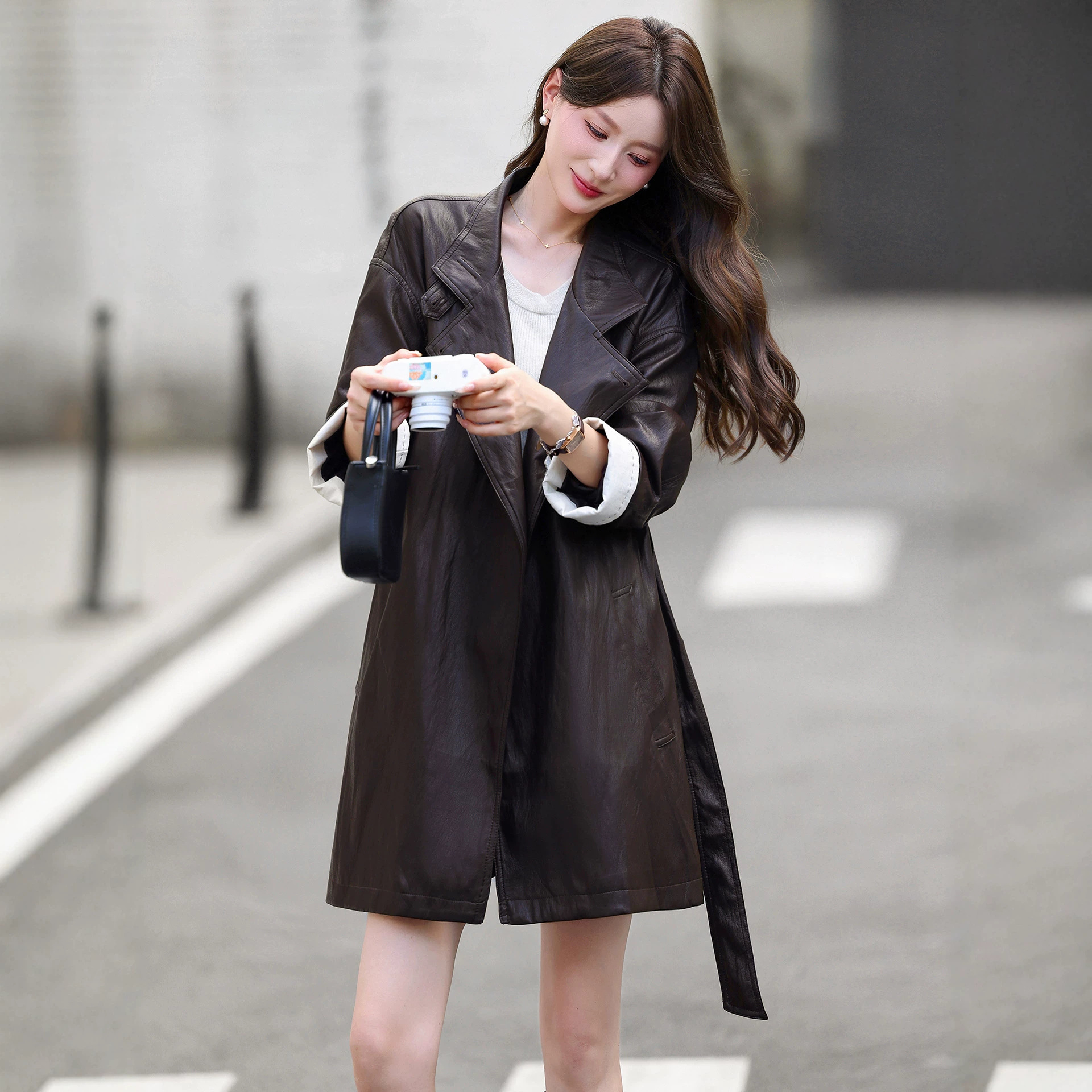 Haining high-end women's mid-length leather jacket 2026 spring and autumn new style, sophisticated and stylish, loose-fitting sheepskin coat