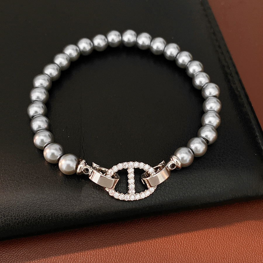 Pulsera de perla de nariz de cerdo de piedra de diamante redonda, pulsera ligera y lujosa, pulsera de nicho, joyas de moda versátiles.