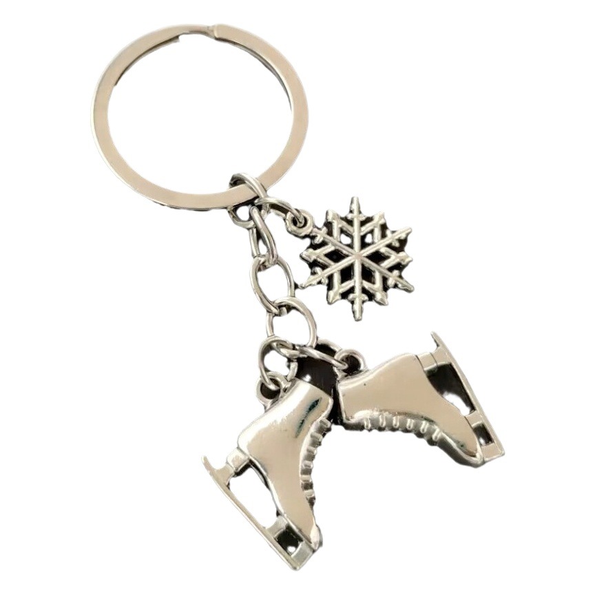 Nuevo invierno europeo y americano transfronterizo Venta caliente copo de nieve patines aleación llavero Navidad joyería