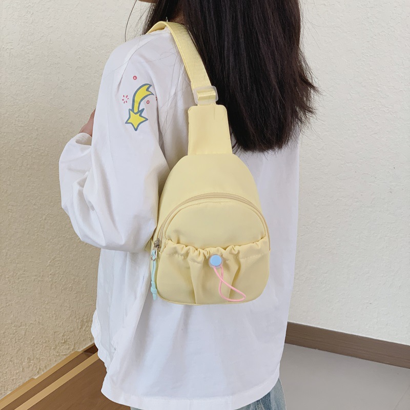 Bolso de pecho simple de color sólido para niños y niñas, bolso de ocio, bolso de mochila infantil ligero, 2026 nuevo bolso de cambio para niños