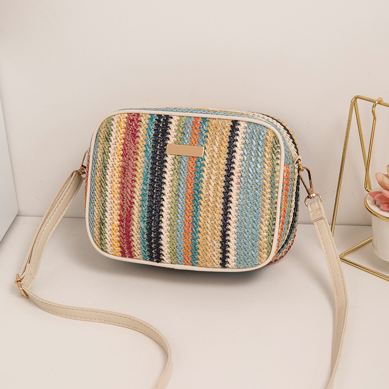 Fábrica directa 2023 nuevo estilo simple de moda de calle de paja bolsa de moda trenzada estilo extranjero de moda mochila de hombro image 9
