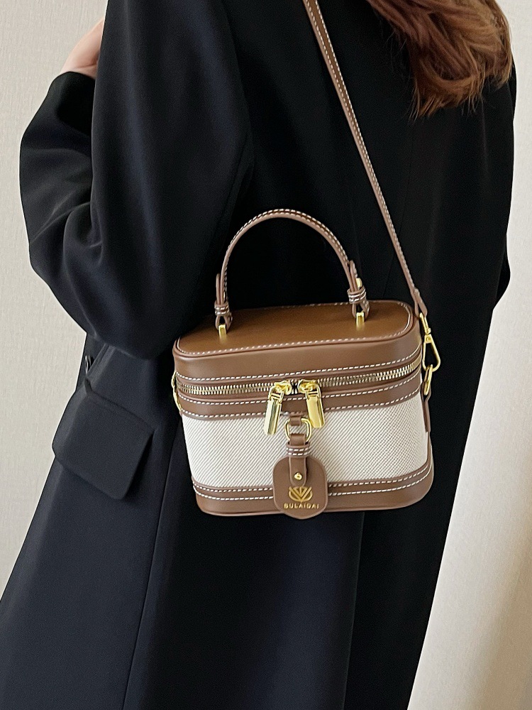 Bolso de mano de alta sensación para mujeres 2025, nueva moda transfronteriza, bolso de caja de empalme de color, bolso casual, bolso cuadrado simple