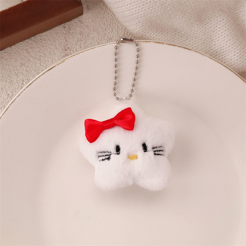 Nuevo estilo de felpa linda de dibujos animados arco estrella muñeca colgante monedero felpa auricular estuche llavero colgante