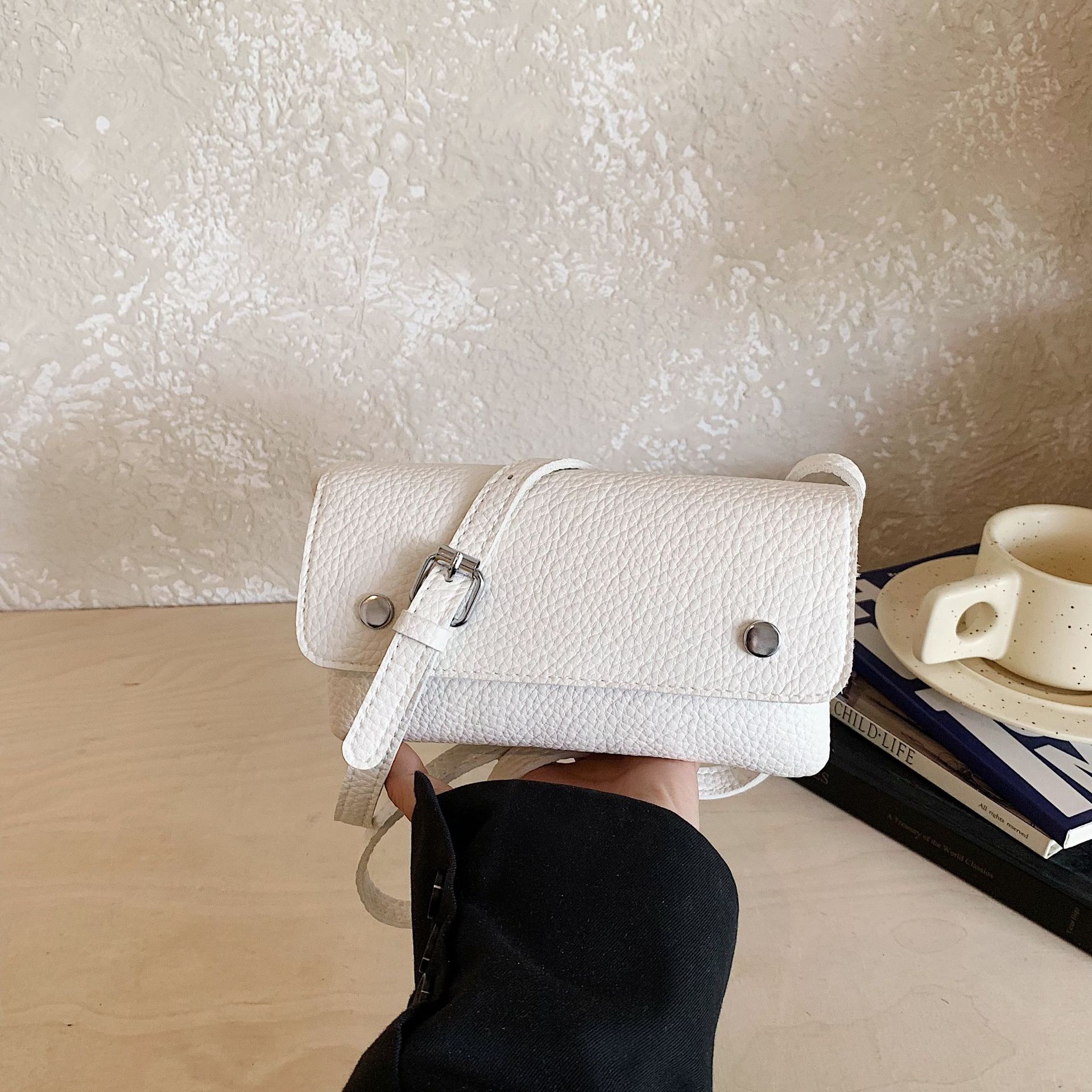 Nicho coreano de transporte universal bolso pequeño para mujeres verano 2026 nuevo multicapa sensación diaria de hombro mochila