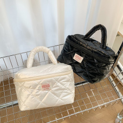 Hisocute high-end pearlescent glossy hand-held cosmetic bag large-capacity down-filled cotton rhombus toiletry storage bag