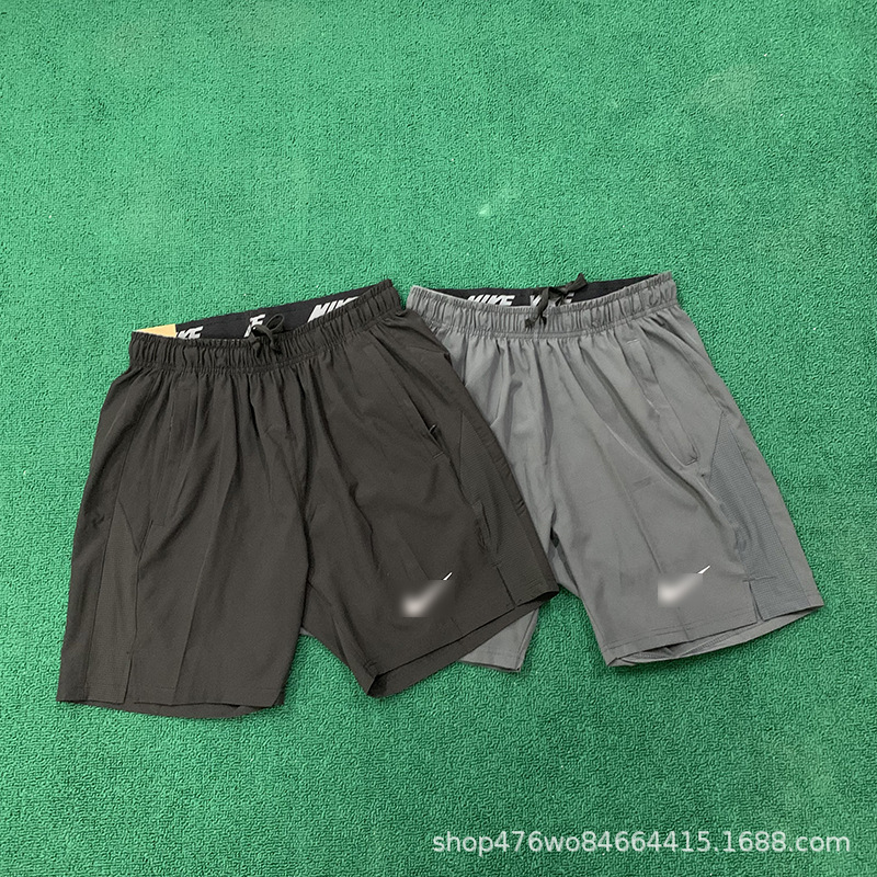 Pantalones cortos finos de verano de secado rápido Pantalones cortos de deportes de carrera tejidos sueltos casuales para hombres