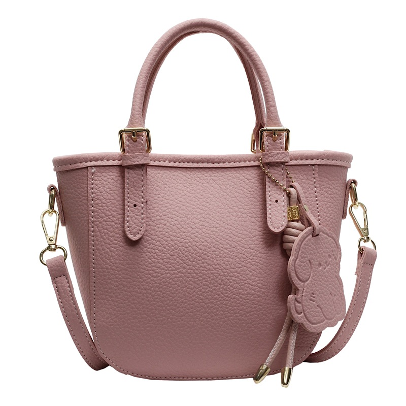 Bolsa de cubo portátil de comercio exterior 2025 nuevo bolso de mochila de textura universal nicho de diseño de red de popularidad explosiva bolso de hombro