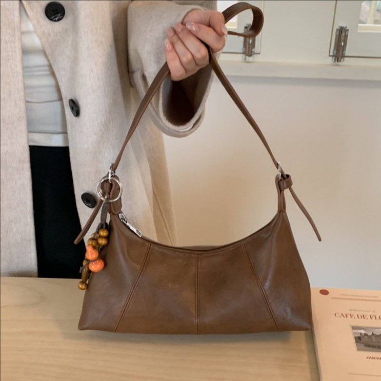 Bolsa de brazo retro transfronteriza para mujeres otoño y invierno 2025, nueva moda de nicho popular, bolsa de hombro universal, bolsa de transporte