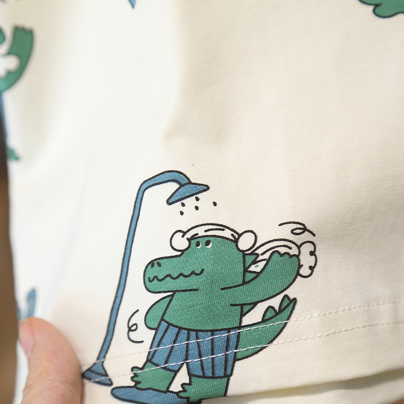 7947 Traje de manga corta para niños 2025 Nuevo verano Camiseta con estampado de dinosaurios de dibujos animados para niños Ropa de moda de verano