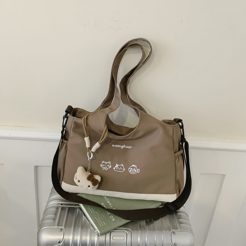 2026 nuevo lindo bolso de tote nicho de moda simple textura de viaje universal mujer gran capacidad mochila de hombro