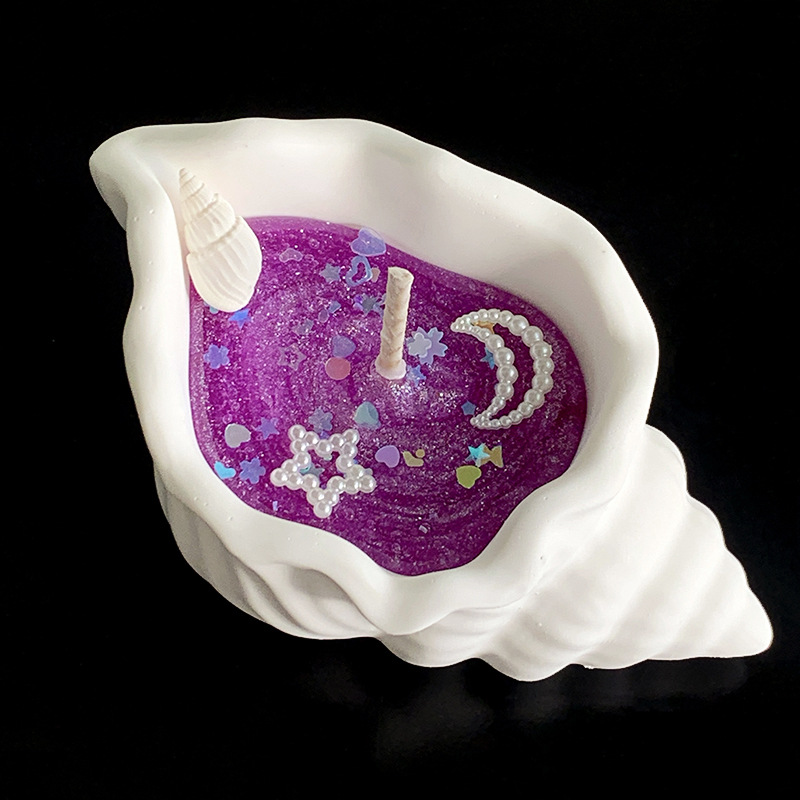 Doftljus formad som snäcka i presentförpackning för stämning_voghion.com