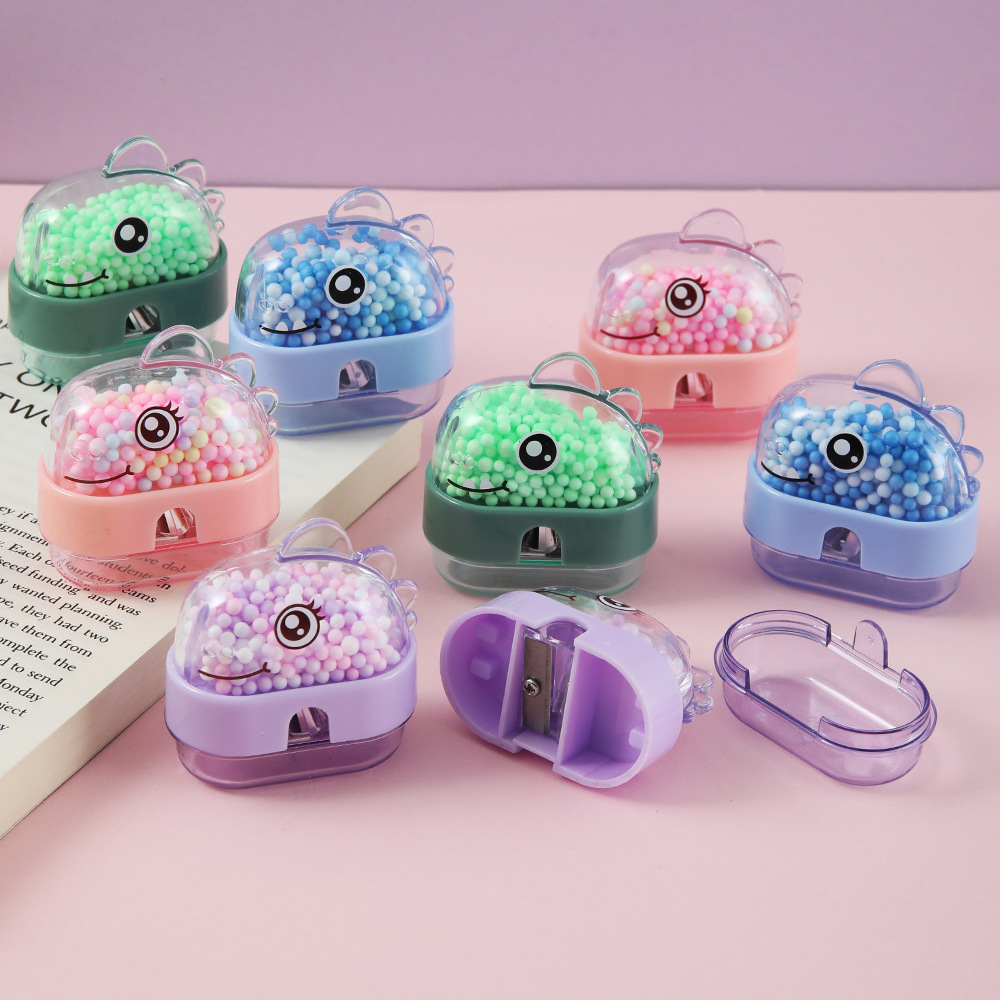 Bonito dinosaurio espuma bola lápiz cuchillo de lápiz de bola de burbujas colorida Tiranosaurus afilador de lápiz estudiante cuchillo de lápiz papelería