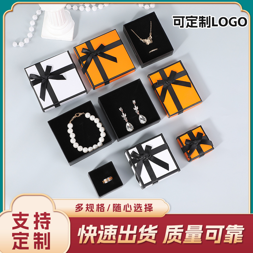 Caja de embalaje de joyería de Xiaoxiangfeng Anillo Pendientes Collar Regalos de vacaciones Tapa de cielo y tierra de alta gama Caja de papel de lazo al por mayor