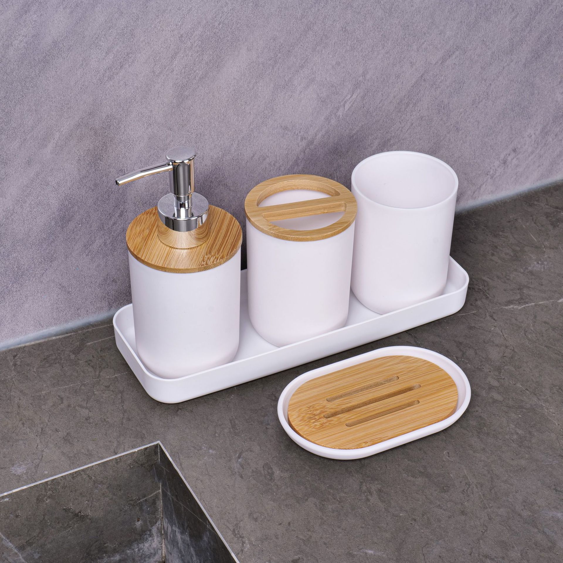 Baño transfronterizo de cuatro piezas Baño de hotel Juego de lavado Cepillado Taza de enjuague bucal Bomba de loción Viento de lujo ligero Ventas de fábrica