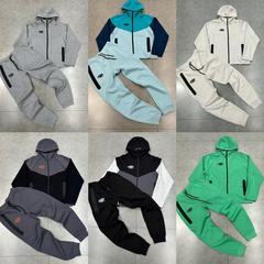 美潮Syna小標刺繍は色とベルベットの男女のカーディガンと帽子のコートをつなぎ合わせてカジュアルなジッパーのズボンセットをつなぎ合わせた