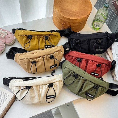 Children's Korean-style minimalist drawstring baby chest bag, stylish unisex children's casual crossbody bag, outdoor lightweight small waist bag