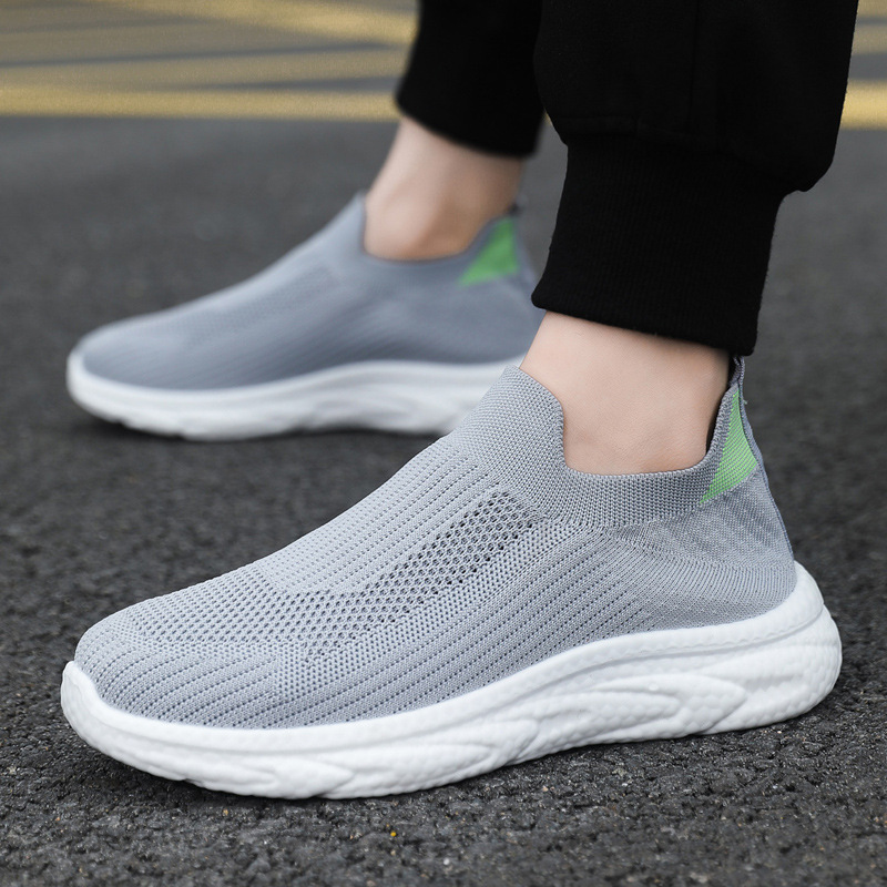 Zapatos de hombre transfronterizos perezosos de un pie 2025 primavera y verano malla zapatos de hombre zapatos casuales zapatos de todo fósforo de color sólido de fondo suave tejido volador