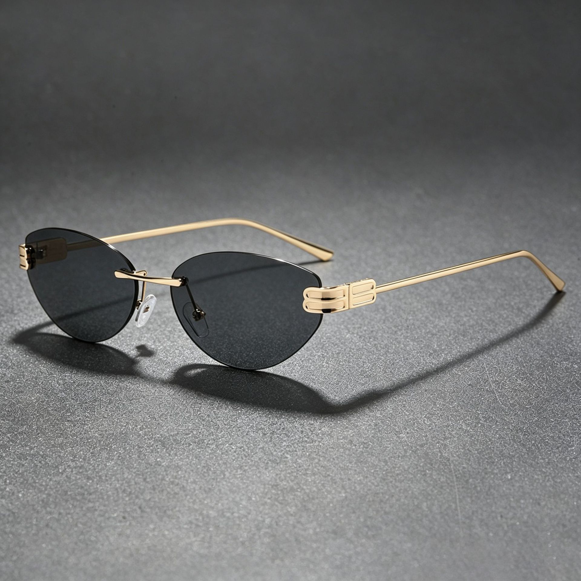 New B-brand rimless oval cat-eye sunglasses, a trendy and versatile metal frame for women, popular among European and American influencers, exuding a sophisticated and high-end aesthetic