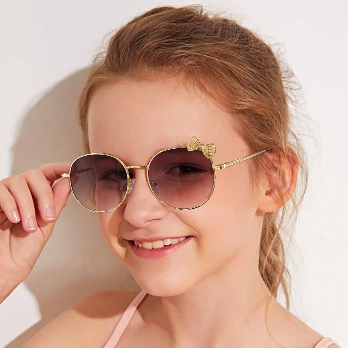 Nuevos accesorios de lazo de marco redondo de metal transfronterizo gafas de sol lindas gafas de sol de protección solar esenciales para la moda del bebé