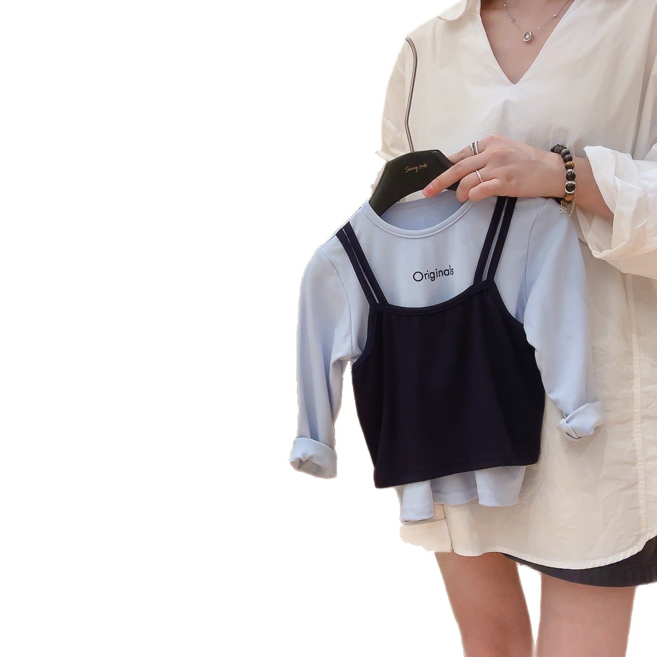 Camiseta de manga larga de niñas otoño 2025 nuevo falso de dos piezas camiseta de otoño camiseta de base para niños de cuello redondo camiseta superior