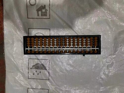 A 17-digit abacus with a clearing device