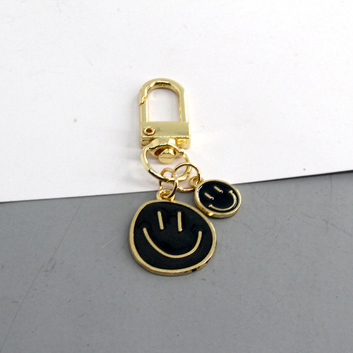 European and American cross-border new cartoon smiley face keychain fashion dripping oil color large and small smiley face pendant girl heart pendant