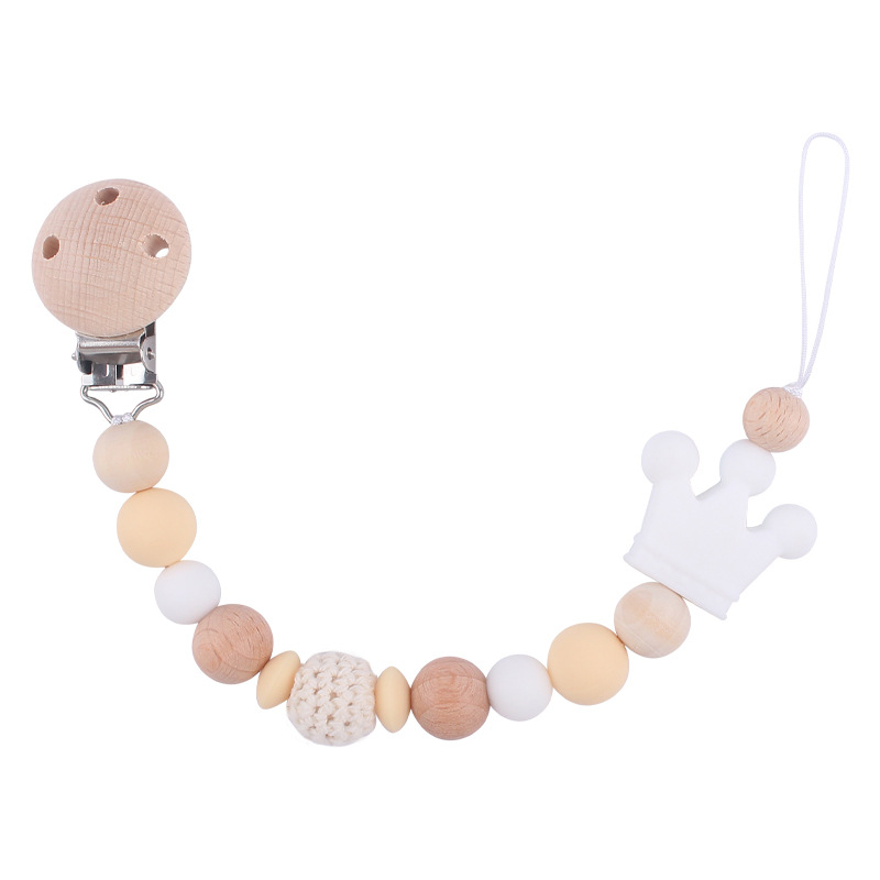 Nuevo bebé suministros Beech chupete clip DIY corona de dibujos animados mordedura de silicona molares chupete cadena anti-caída