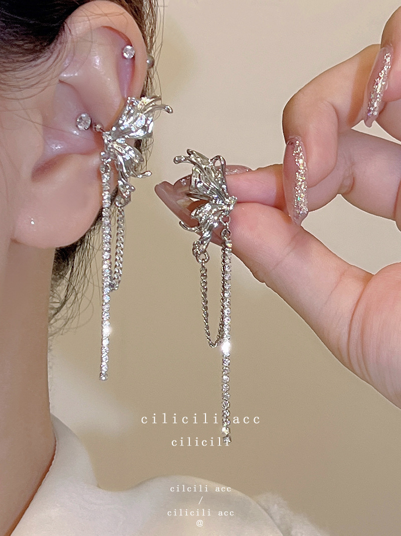 Diseño de nicho de alta gama borla larga sin orejas clip de oreja elegante estilo occidental de las mujeres cara-mirando pequeños nuevos pendientes de moda