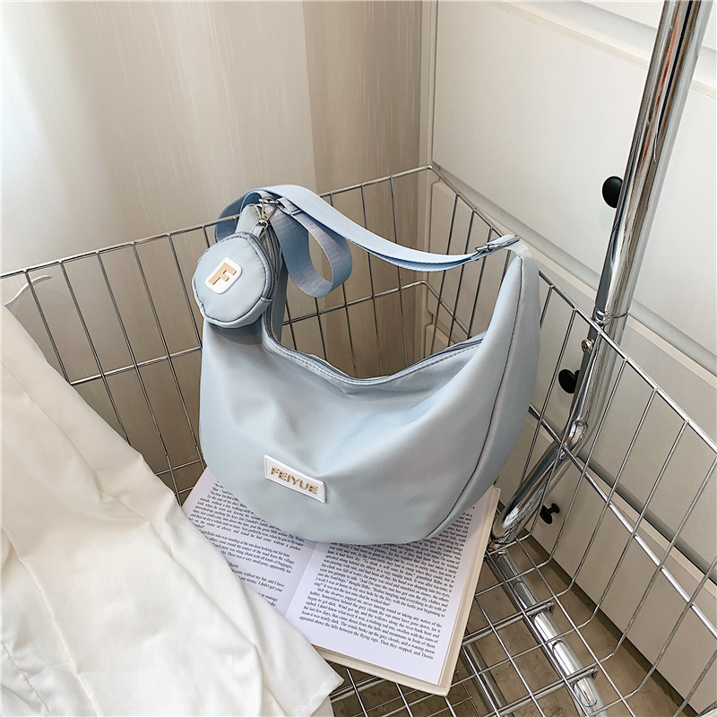 Bolsa de bolinillos de gran capacidad 2025, primavera nueva bolsa de viaje, bolsas de hombro inclinadas para estudiantes universitarios.