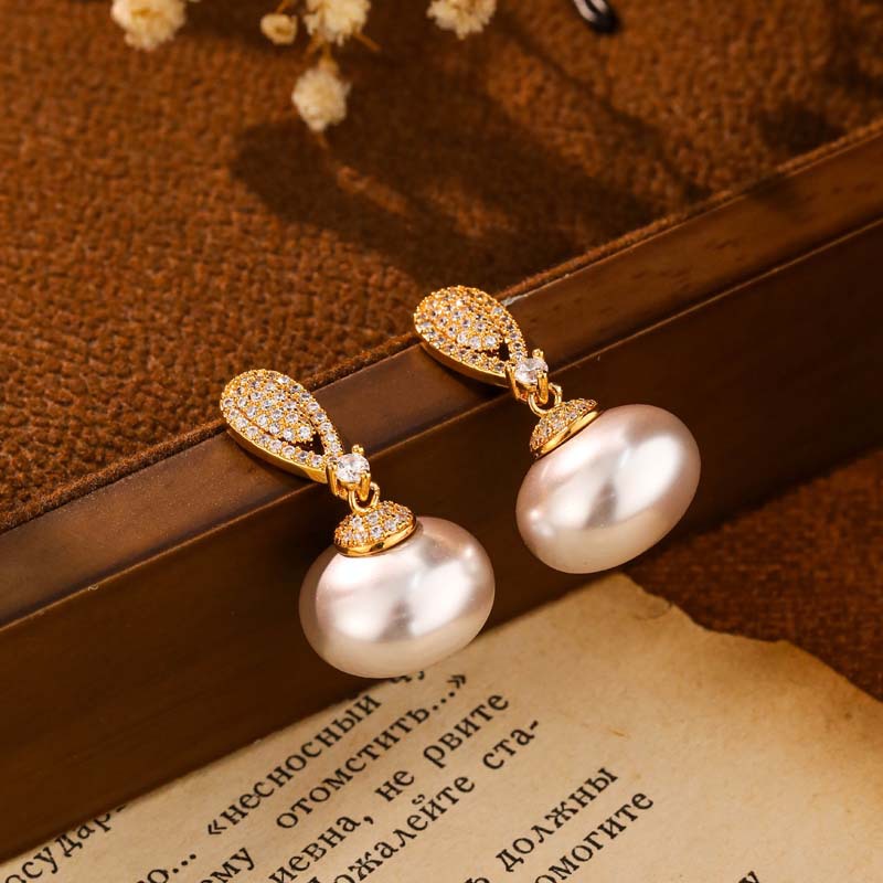 Elegant earrings with zircon drop-shaped from pearl