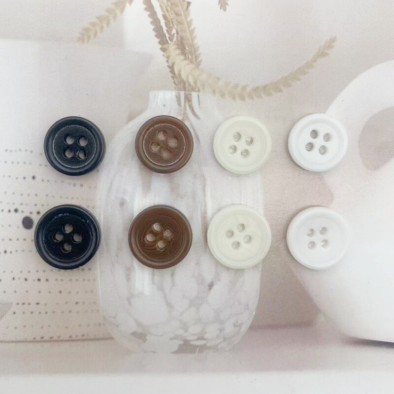 Resin black pattern two-eye shirt fish-eye button delicate four-eye beige button brown shirt button in stock wholesale
