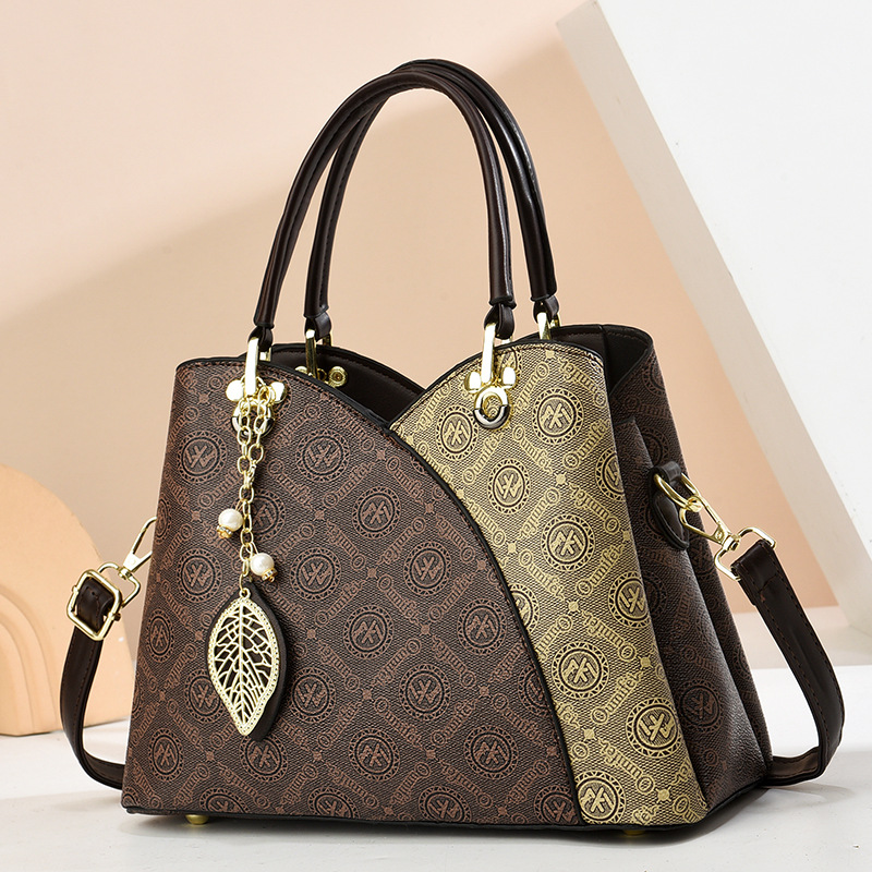 2025 verano nuevo bolso de moda de mediana edad bolso de mujer bolso de hombro mochila atmósfera bolso de madre universal