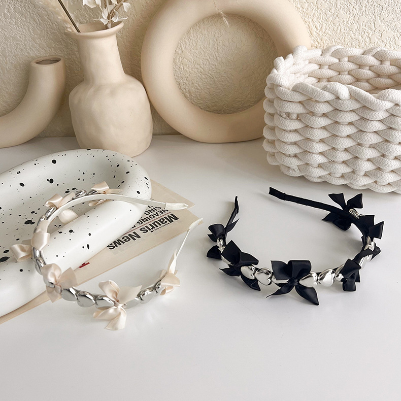 Korean Three-dimensional Metal Heart Bow Ribbon Simple Thin Hairband Wholesale display picture 3