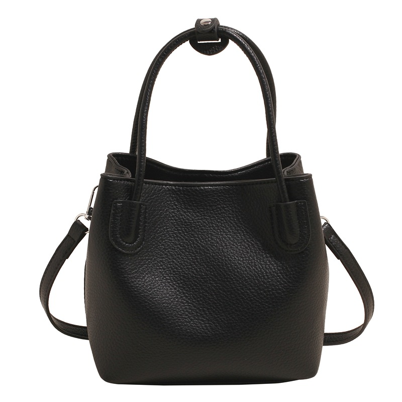 Bolso de cubo portátil de moda coreana para mujer 2025 primavera y verano nuevo bolso de mensajero de un solo hombro casual de alta gama simple