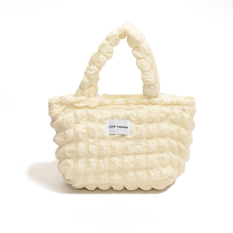 Versión coreana del nuevo bolso de hombro de color caramelo de corazón de niña pliegue de burbuja de nube simple bolso de gran capacidad mujer