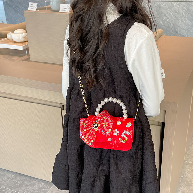 Primavera y verano nueva celebridad en línea bolso de los niños moda Chanel estilo princesa bolsa pequeña niña linda bolsa de mensajero portátil al por mayor